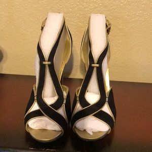 Stylish black and gold suede pumps